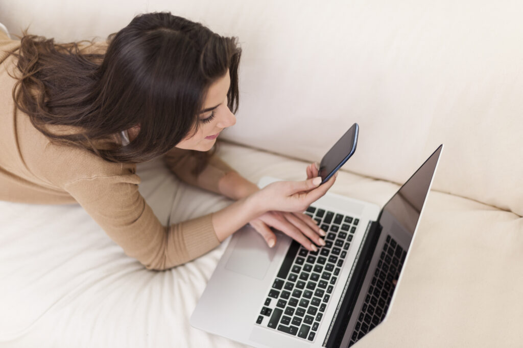 woman using qr code on computer